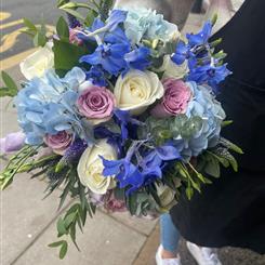 Blue delphinium lilac rose blue hydrangeas bouquet 