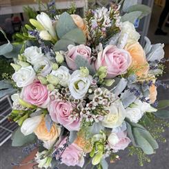 Pale pinks whites and peach bridal bouquet 