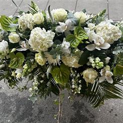 White and green casket spray 