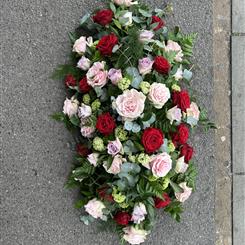 Pink and red rose casket spray 