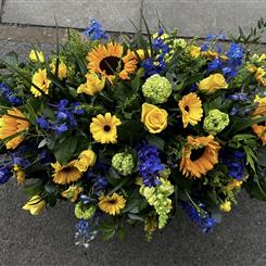 Blue and yellow Casket Spray